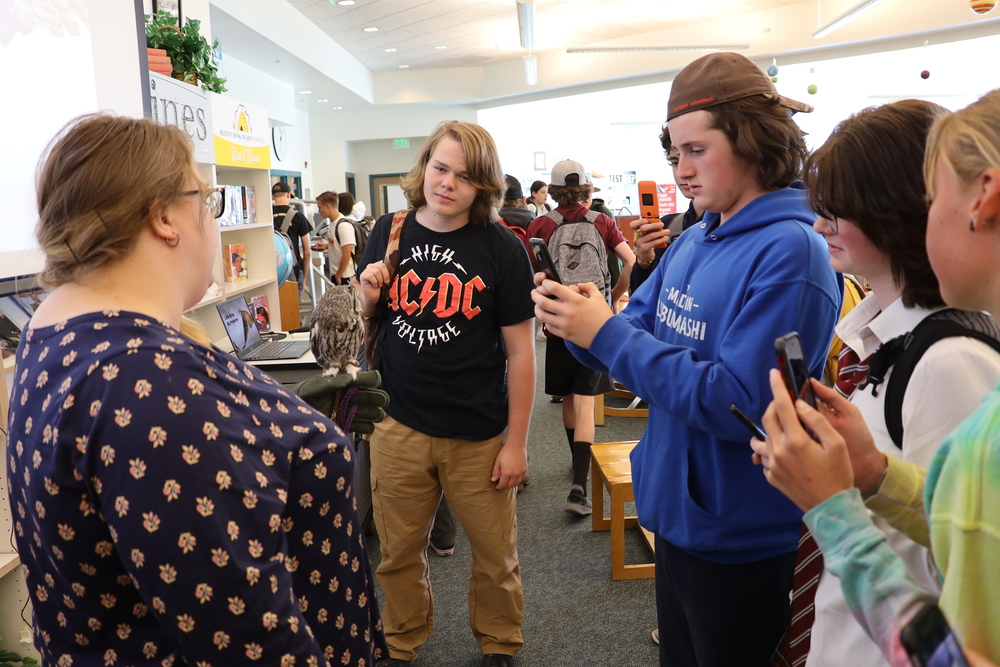 Students speak with a HawkWatch volunteer