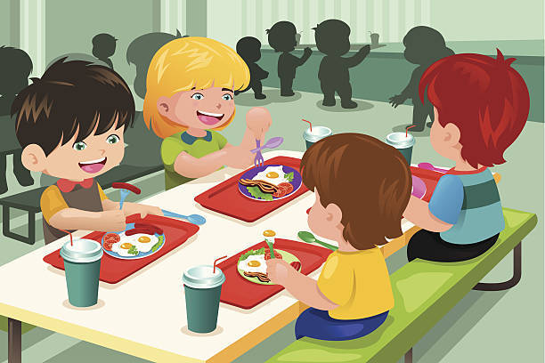 4 kids eating school lunch at a table