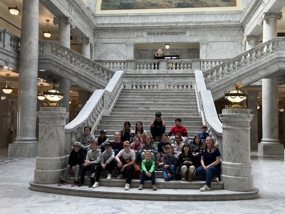 Students pose on the steps inside the Capitol Rotunda