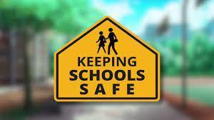 sign saying keeping schools safe