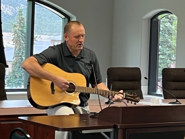 Superintendent Hatch plays the guitar