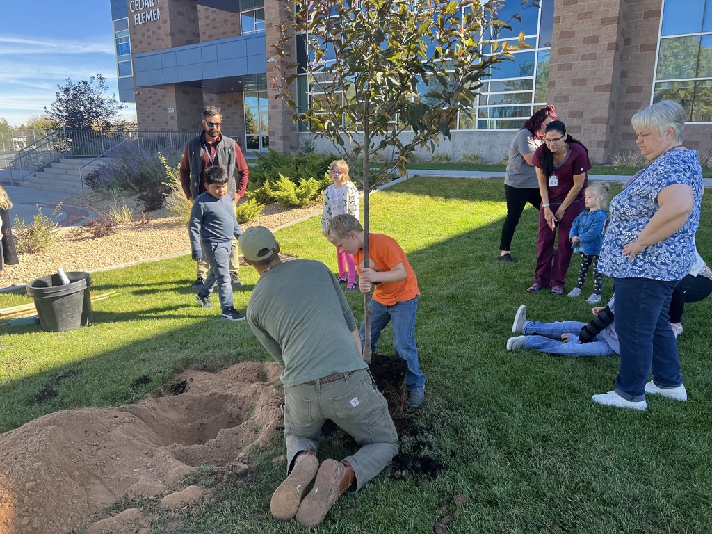 Students planting a tree at North Elementary